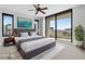 Bright bedroom with a king bed, ceiling fan, and access to a private balcony with city views at 401 S Palm Ave # 801, Sarasota, FL 34236