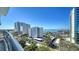 Stunning view of the cityscape featuring high-rise buildings, blue skies, and green spaces at 401 S Palm Ave # 801, Sarasota, FL 34236