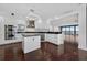 Modern kitchen with island, stainless steel appliances, white cabinets, and an open floor plan at 401 S Palm Ave # 801, Sarasota, FL 34236