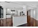 Spacious open-concept kitchen with stainless steel appliances, white cabinets, and a kitchen island at 401 S Palm Ave # 801, Sarasota, FL 34236