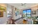 Cozy living room with built-in shelving, hardwood floors, and a large window with city views at 401 S Palm Ave # 801, Sarasota, FL 34236