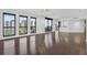 Bright, airy living room with hardwood floors, multiple windows, and city views at 401 S Palm Ave # 801, Sarasota, FL 34236