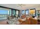 Bright living room with floor to ceiling windows, comfortable furniture, and panoramic views of the city at 401 S Palm Ave # 801, Sarasota, FL 34236