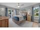 Comfortable bedroom featuring a king-size bed, patio access, and stylish decor at 4023 Center Pointe Pl # 3A, Sarasota, FL 34233