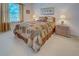 Comfortable bedroom with a tranquil ambiance and soft natural light at 403 Auburn Lakes Cir # 403, Venice, FL 34292