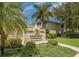 Auburn Lakes Condominium community sign surrounded by lush landscaping in a serene setting at 403 Auburn Lakes Cir # 403, Venice, FL 34292