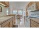 Open kitchen with plenty of cabinets, modern appliances and a view to the dining area at 403 Auburn Lakes Cir # 403, Venice, FL 34292