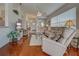 Cozy living room with hardwood floors and a view of the entry foyer and dining area at 403 Auburn Lakes Cir # 403, Venice, FL 34292