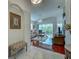 Inviting living room with hardwood floors, neutral furniture, and a view of the lanai at 403 Auburn Lakes Cir # 403, Venice, FL 34292