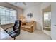 Comfortable office area featuring a sofa and large sunny window at 403 Auburn Lakes Cir # 403, Venice, FL 34292