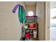 Organized storage area with shelves, cleaning supplies, and a round window for natural light at 403 Auburn Lakes Cir # 403, Venice, FL 34292