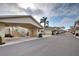 Street view showcasing the building's carports and architecture at 403 Auburn Lakes Cir # 403, Venice, FL 34292