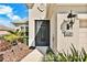 Inviting front entrance features a decorative screened door, manicured landscaping and clear house number at 4439 29Th Avenue E Cir, Palmetto, FL 34221