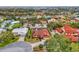 Aerial view highlights the home's location within a desirable neighborhood and mature trees at 445 W Gate Dr, Venice, FL 34285