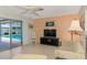 Comfortable living room area with sliding glass doors leading to the refreshing backyard pool at 445 W Gate Dr, Venice, FL 34285