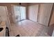 Bright eat-in kitchen featuring tile flooring, sliding door to patio, and large closet at 4506 Runabout Way, Bradenton, FL 34203