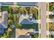 Aerial shot of property shows lush landscaping and proximity to neighborhood streets and nearby homes at 4623 Claremont Park Dr, Lakewood Ranch, FL 34211