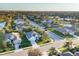 An elevated view of a residential area featuring well-manicured lawns and houses with community ponds at 4623 Claremont Park Dr, Lakewood Ranch, FL 34211