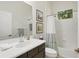 Bathroom with a modern vanity, framed artwork, and a shower-tub combination at 4623 Claremont Park Dr, Lakewood Ranch, FL 34211