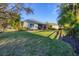 Well-maintained exterior with manicured lawn and landscaping, complemented by a screened-in lanai at 4623 Claremont Park Dr, Lakewood Ranch, FL 34211