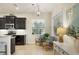 Bright kitchen nook with a window view, dark cabinets, and stainless appliances at 4623 Claremont Park Dr, Lakewood Ranch, FL 34211