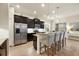 Stylish kitchen boasting granite counters, stainless appliances, and seating at the center island at 4623 Claremont Park Dr, Lakewood Ranch, FL 34211