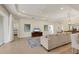 Open-concept living space featuring backyard access, neutral-toned furniture, and a modern design at 4623 Claremont Park Dr, Lakewood Ranch, FL 34211
