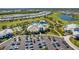 Expansive aerial shot showcasing the community amenities, including the pool and golf course at 4735 Trento Pl, Bradenton, FL 34211