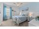 Bright bedroom featuring beach theme, blue accent wall, and carpet flooring at 4735 Trento Pl, Bradenton, FL 34211