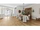 Dining room featuring wood floors, decorative lighting, and elegant furnishings at 4735 Trento Pl, Bradenton, FL 34211