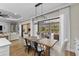 Dining area with access to the outdoor space, modern lighting, and stylish decor at 4735 Trento Pl, Bradenton, FL 34211