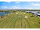 Scenic view of the well-maintained golf course, with lush greenery and sand traps at 4735 Trento Pl, Bradenton, FL 34211