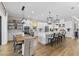 Open kitchen with an island, stainless steel appliances, and an adjacent dining area at 4735 Trento Pl, Bradenton, FL 34211