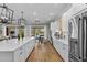 Spacious kitchen with a large island, stainless steel appliances, and an open floor plan at 4735 Trento Pl, Bradenton, FL 34211