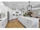 Bright, open kitchen with a large island, stainless steel appliances, and modern pendant lighting at 4735 Trento Pl, Bradenton, FL 34211