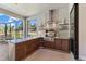 Stylish outdoor kitchen with built-in grill, granite countertops, and ample cabinet space for entertaining at 4735 Trento Pl, Bradenton, FL 34211