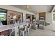 Expansive covered patio featuring a bar, dining area, and cozy seating with pool views at 4735 Trento Pl, Bradenton, FL 34211