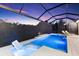 Beautiful pool with built-in seating, sleek design, and private backyard views for luxurious outdoor living at 4735 Trento Pl, Bradenton, FL 34211