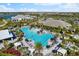 Overhead view of a luxurious community pool with lounge chairs and tropical landscaping at 4735 Trento Pl, Bradenton, FL 34211