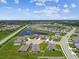 Stunning aerial view of the community with lush landscaping, a serene pond, and well-maintained streets at 4918 Gray Owl Ter, Palmetto, FL 34221