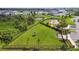 Scenic aerial view of community featuring playground, grassy field and pond at 4918 Gray Owl Ter, Palmetto, FL 34221