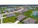Aerial view of the residential community with multiple homes, ponds, and well-maintained landscaping at 4918 Gray Owl Ter, Palmetto, FL 34221