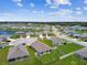 Aerial view of the residential community with multiple homes surrounding serene lakes, offering picturesque views at 4918 Gray Owl Ter, Palmetto, FL 34221