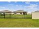 Fenced backyard with lush green grass at 4918 Gray Owl Ter, Palmetto, FL 34221