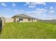 Large, green backyard with a privacy fence, providing a private outdoor space at 4918 Gray Owl Ter, Palmetto, FL 34221