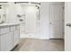 A bathroom features a walk-in shower and updated vanity at 4918 Gray Owl Ter, Palmetto, FL 34221