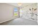 Cozy bedroom with flower accent wall and view to the yard at 4918 Gray Owl Ter, Palmetto, FL 34221