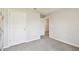 A large bedroom features carpet flooring and a double-door closet at 4918 Gray Owl Ter, Palmetto, FL 34221