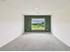 Bedroom featuring neutral paint, carpet, and a window overlooking the outdoors at 4918 Gray Owl Ter, Palmetto, FL 34221