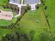 Aerial view of a fenced dog park and playground area, providing recreational space for both pets and families at 4918 Gray Owl Ter, Palmetto, FL 34221